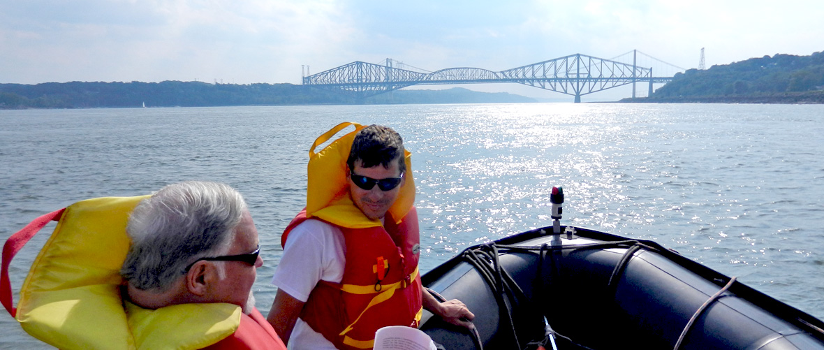 Quebec Bridge over the St. Lawrence River boat zodiac